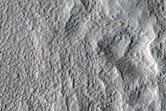 Crater and Trough in Tempe Terra