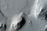Flat-Topped Sinuous Ridge Contacting Pedestal Crater