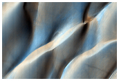 Colliding Sand Dunes in Aonia Terra