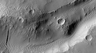 An Irregular Crater Intersecting Graben in Tractus Albus